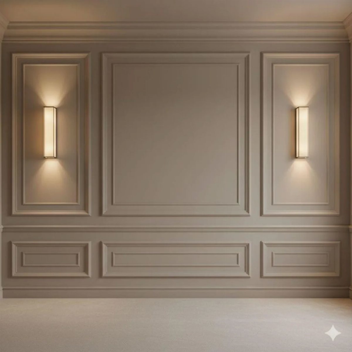 Beige wall with decorative rectangular molding panels and two glowing vertical wall sconces.
