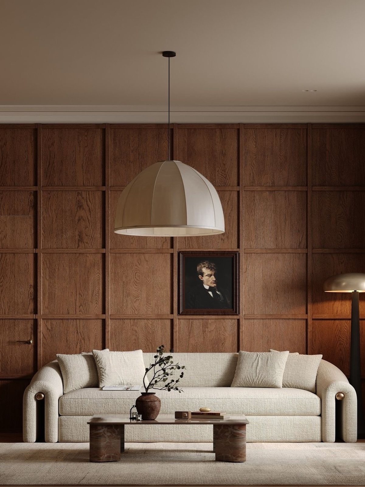 Dark wood panel walls with a grid pattern behind a cream sofa and pendant light.